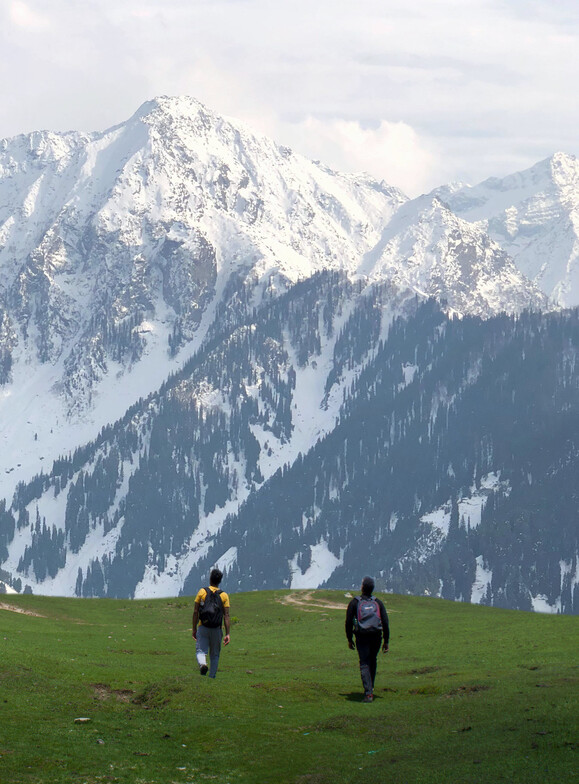 Two people on journey to each new peak or milestone
